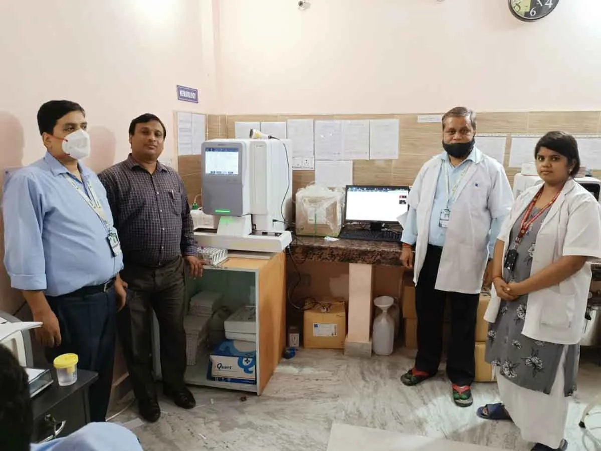Laboratory staff and the Avien Bio team in a laboratory with installed instruments
